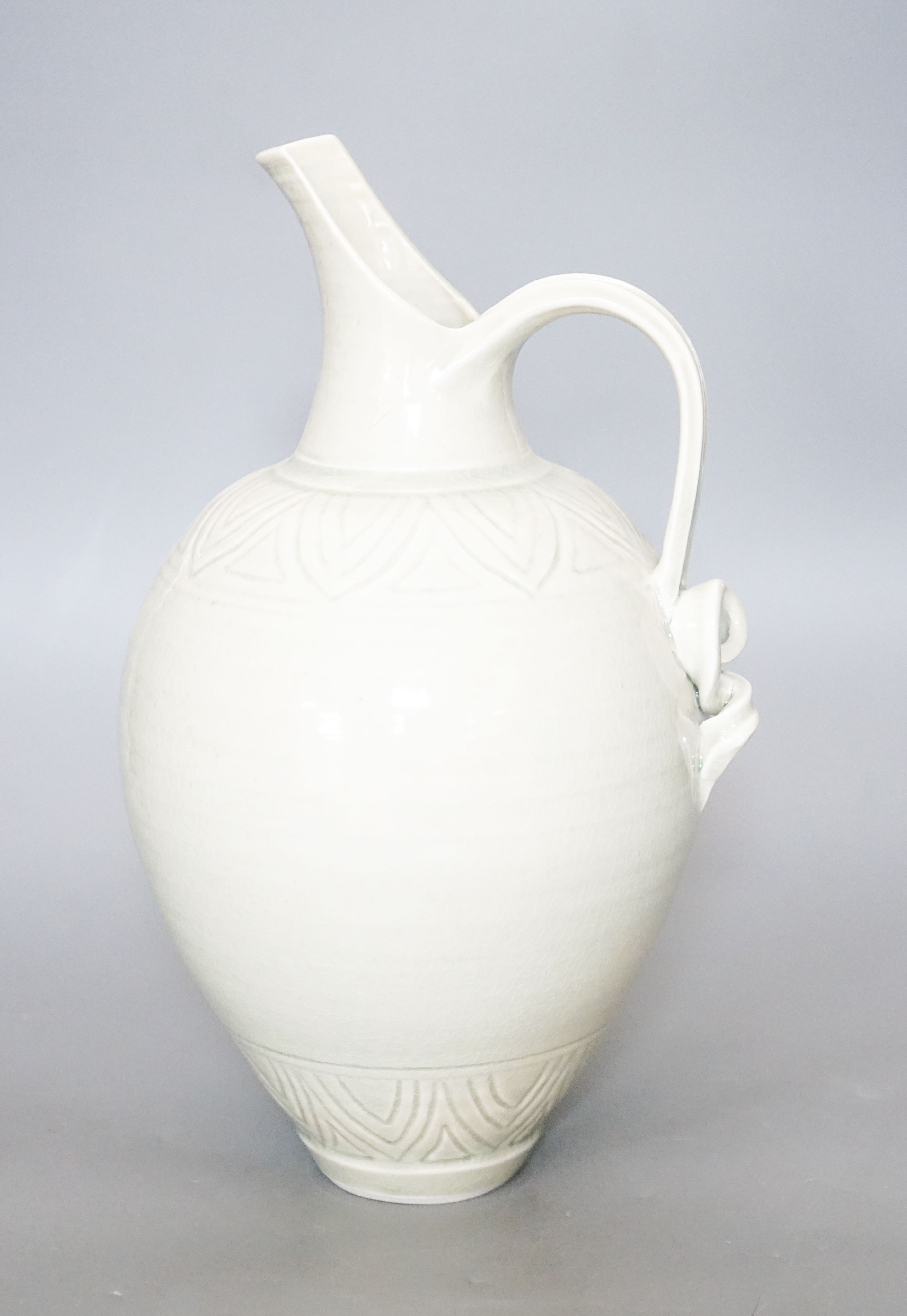 Bridget Drakeford (b.1946), a celadon glazed porcelain jug 30cm